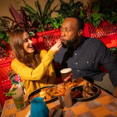 2 Friends Sharing Food and Drinks 1 (1)
